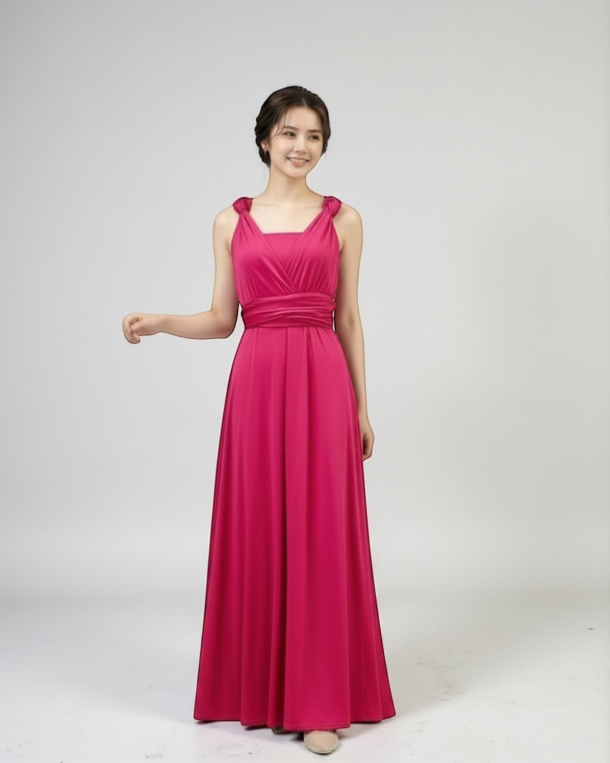 BridesmaidsJP infinity dress in vibrant azalea pink, floor-length, convertible neckline, with a matching sash.