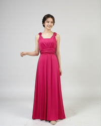 BridesmaidsJP infinity dress in vibrant azalea pink, floor-length, convertible neckline, with a matching sash.