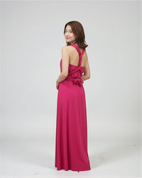 BridesmaidsJP fuchsia pink infinity dress on a model, convertible for multiple styles, floor-length, jersey fabric.