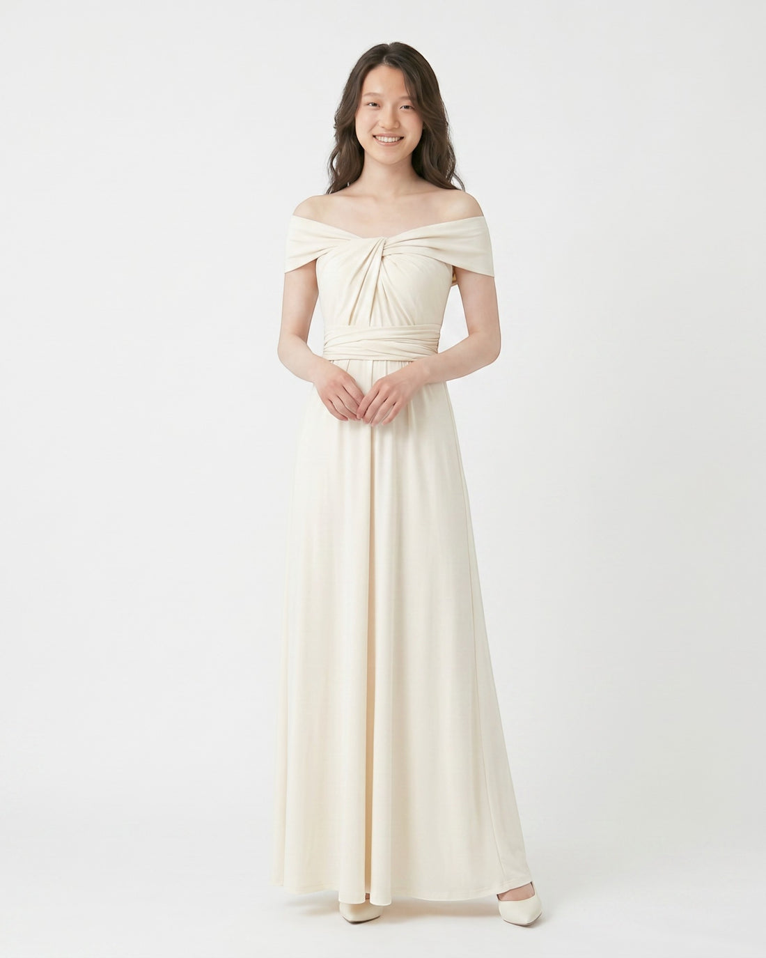 BridesmaidsJP ivory infinity dress with off-the-shoulder neckline and ruched bodice, worn by a model against a white background.