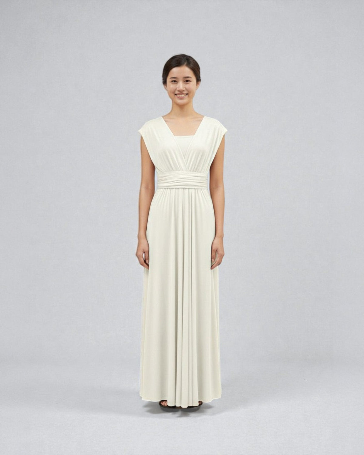 BridesmaidsJP ivory white infinity dress with a square neckline and ruched waistband, worn by a smiling woman.