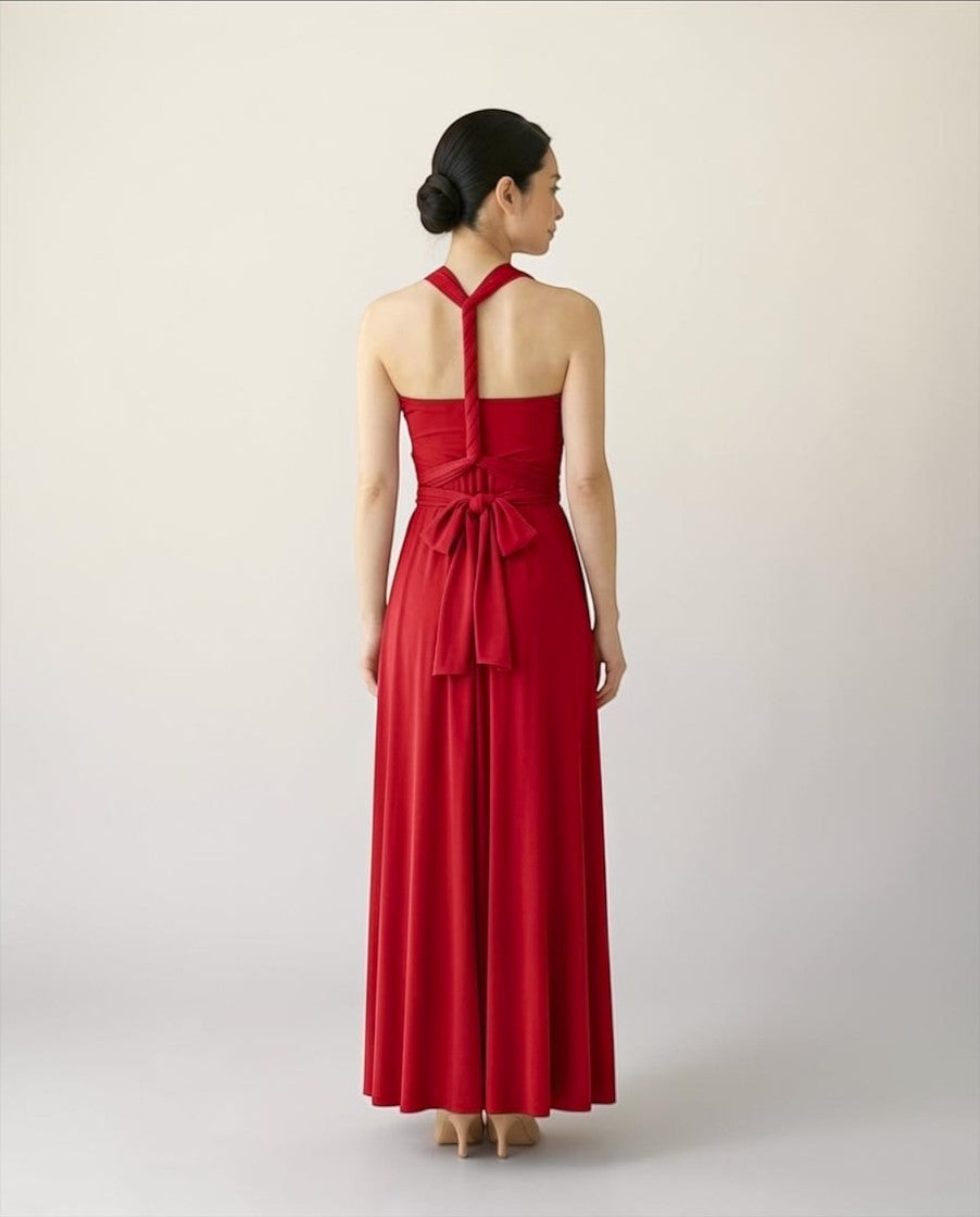 BridesmaidsJP red infinity dress with braided straps and a tie waist, worn by a woman from behind.