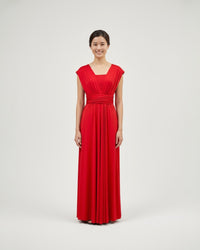 BridesmaidsJP red infinity dress with a sweetheart neckline and ruched waist, made of jersey material. Floor-length.