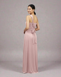 BridesmaidsJP smokey pink infinity dress with a twisted strap and tie waist, worn by a model.