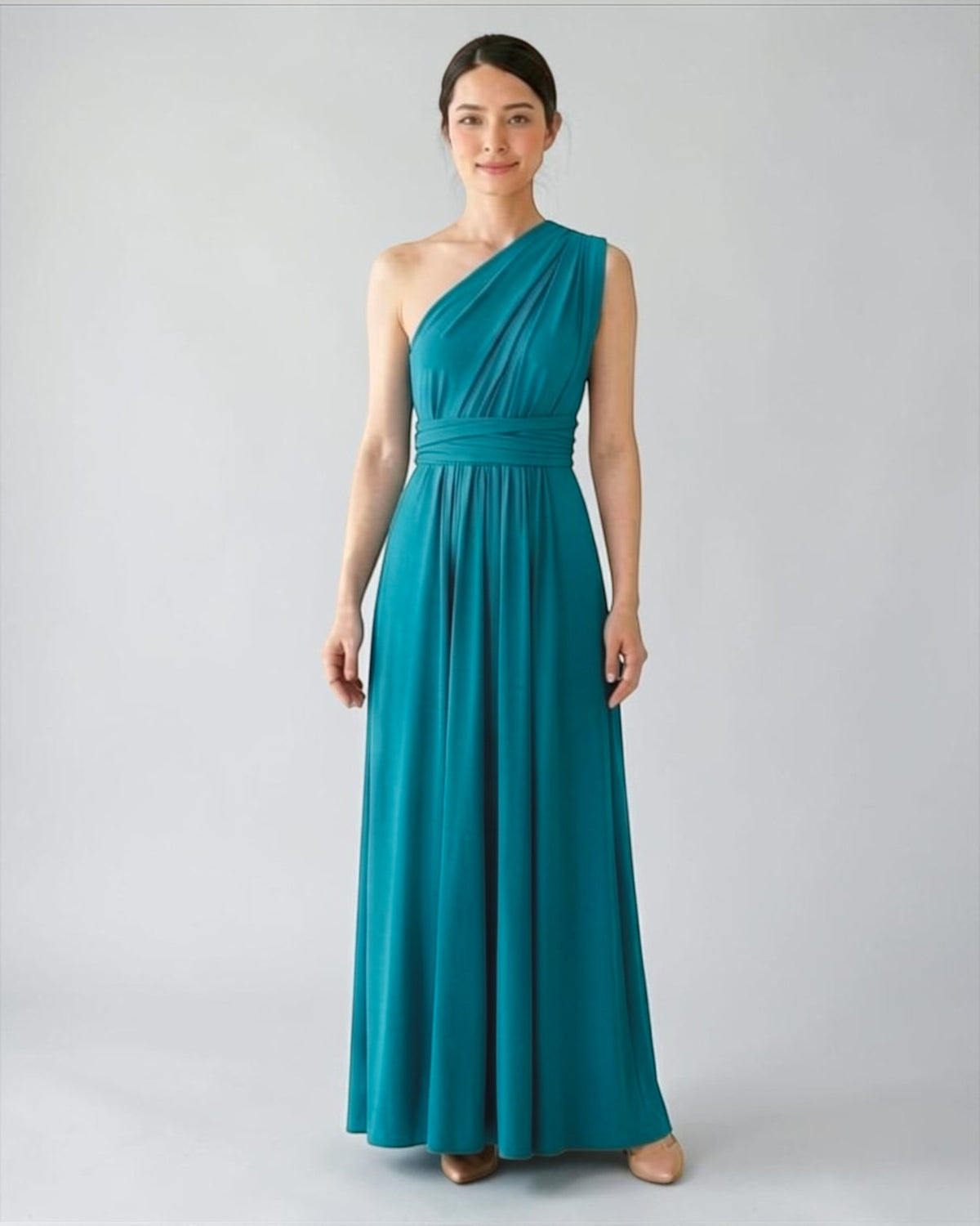 BridesmaidsJP turquoise long infinity dress with one-shoulder draped neckline and matching sash, made of soft jersey fabric.